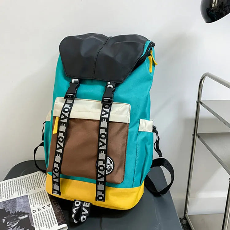 Oxford cloth student backpack in black, green, or red, showing handheld and shoulder straps.