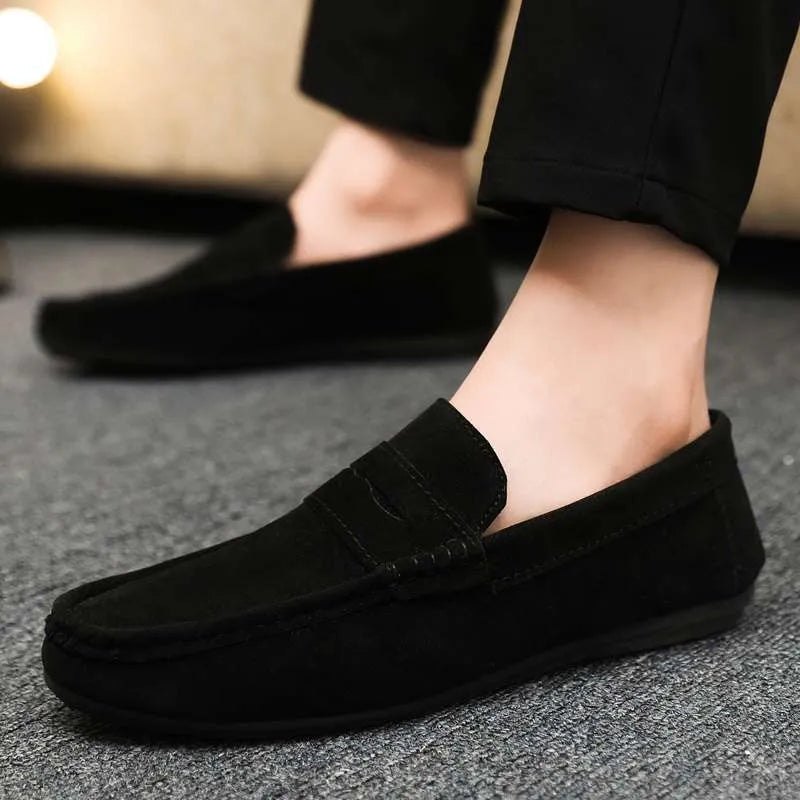 Men's Gommino Korean fashion slip-on shoes in black colour showing round toe and textured upper