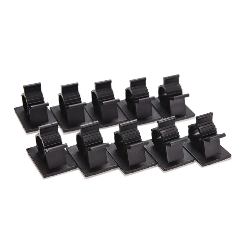 Black nylon adhesive cable clamps on a white background, showing self-adhesive backing and two-stage lock design.