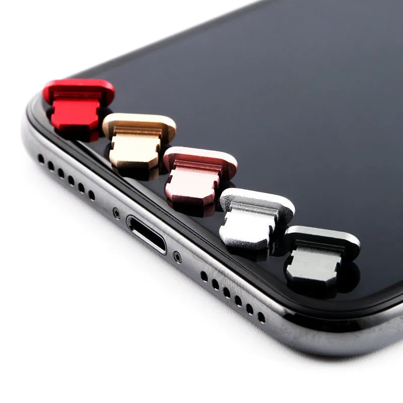 Aluminium alloy iPhone charging port dust plug in gold, silver, blue, red, grey, black, and rose gold colours.