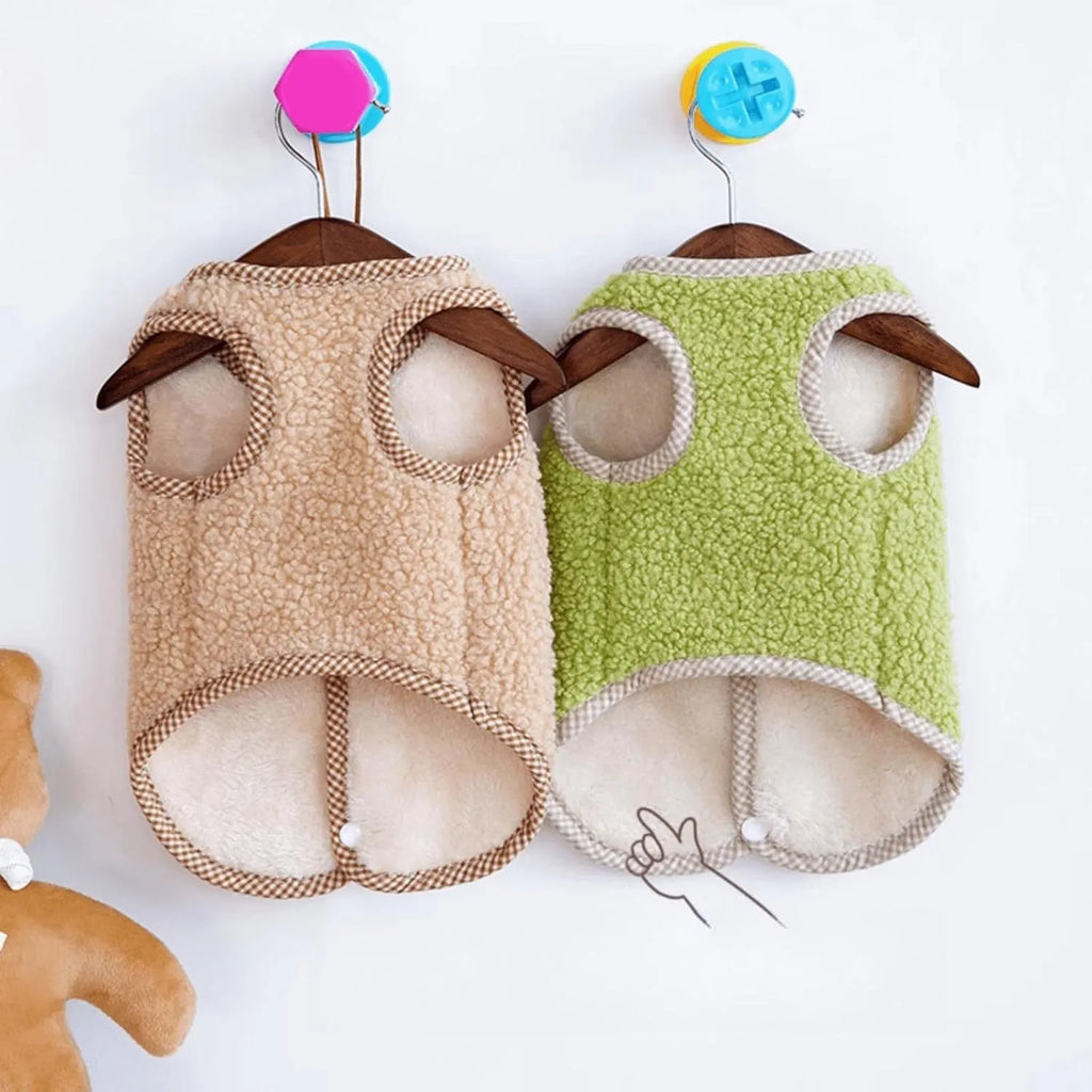 Green coral fleece dog vest with a leash ring on a small dog.
