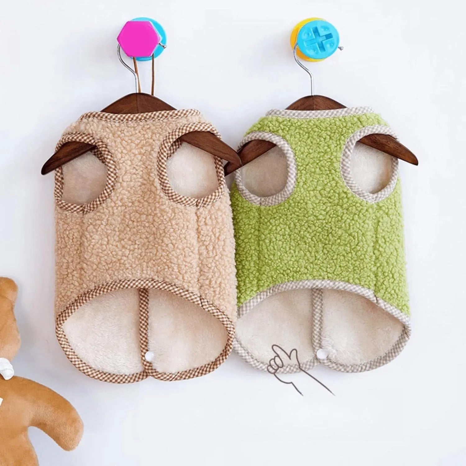 Green coral fleece dog vest with a leash ring on a small dog.
