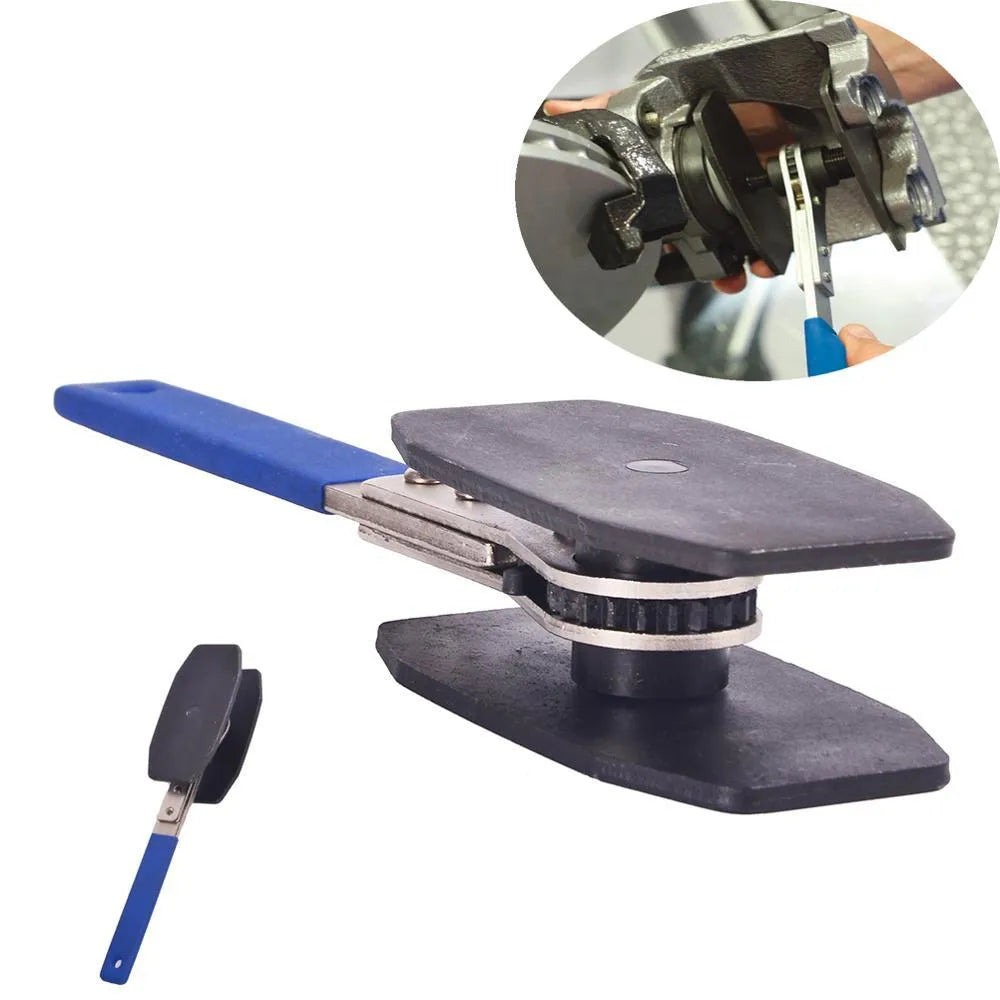 Black stainless steel brake caliper press with ratchet mechanism on bench
