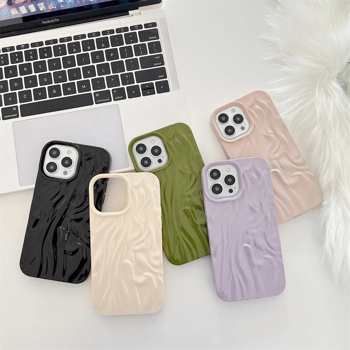 Ins-style water ripple silicone phone case for iPhone in milky white, showing textured surface.