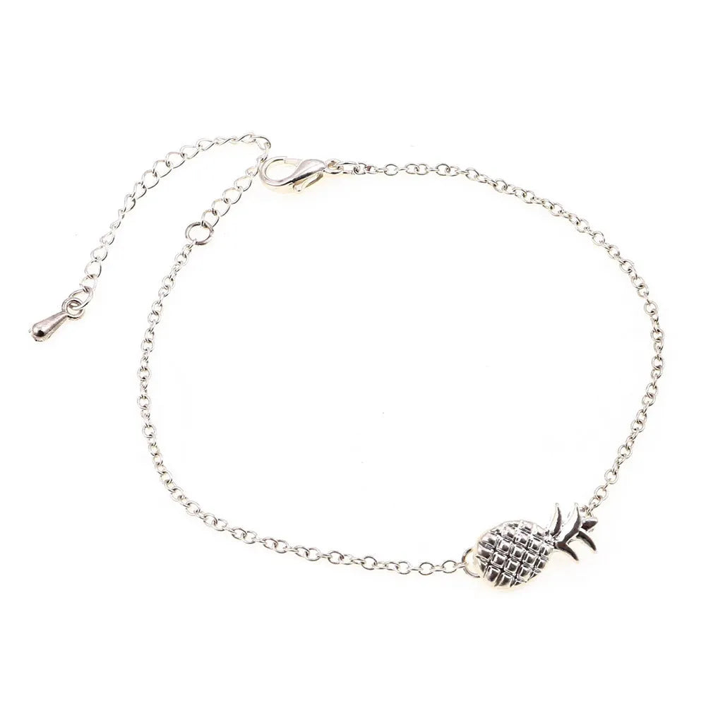 Women's alloy bracelet with pineapple fruit charm in gold or silver finish showing adjustable closure