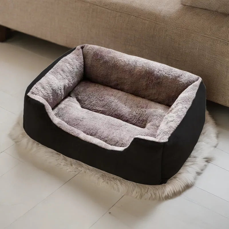Soft short plush cat bed in grey, shown in a medium size for scale with a cat.