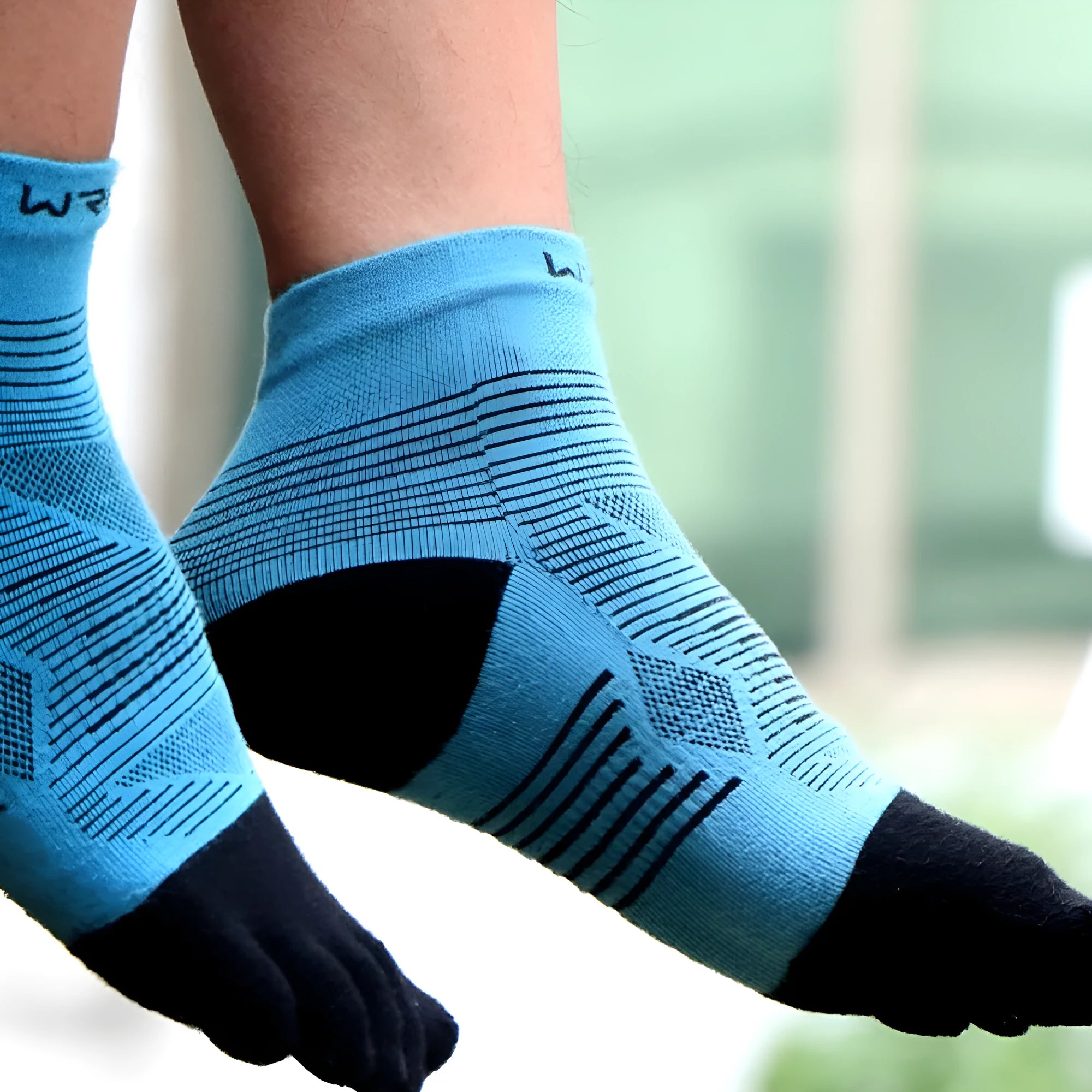 A pair of professional sports toe socks in COOLMAX fabric shown in black and gray colour.