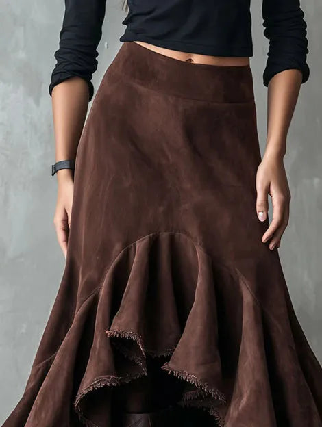 Western brown high-low maxi skirt with ruffled ankle hem laid flat.