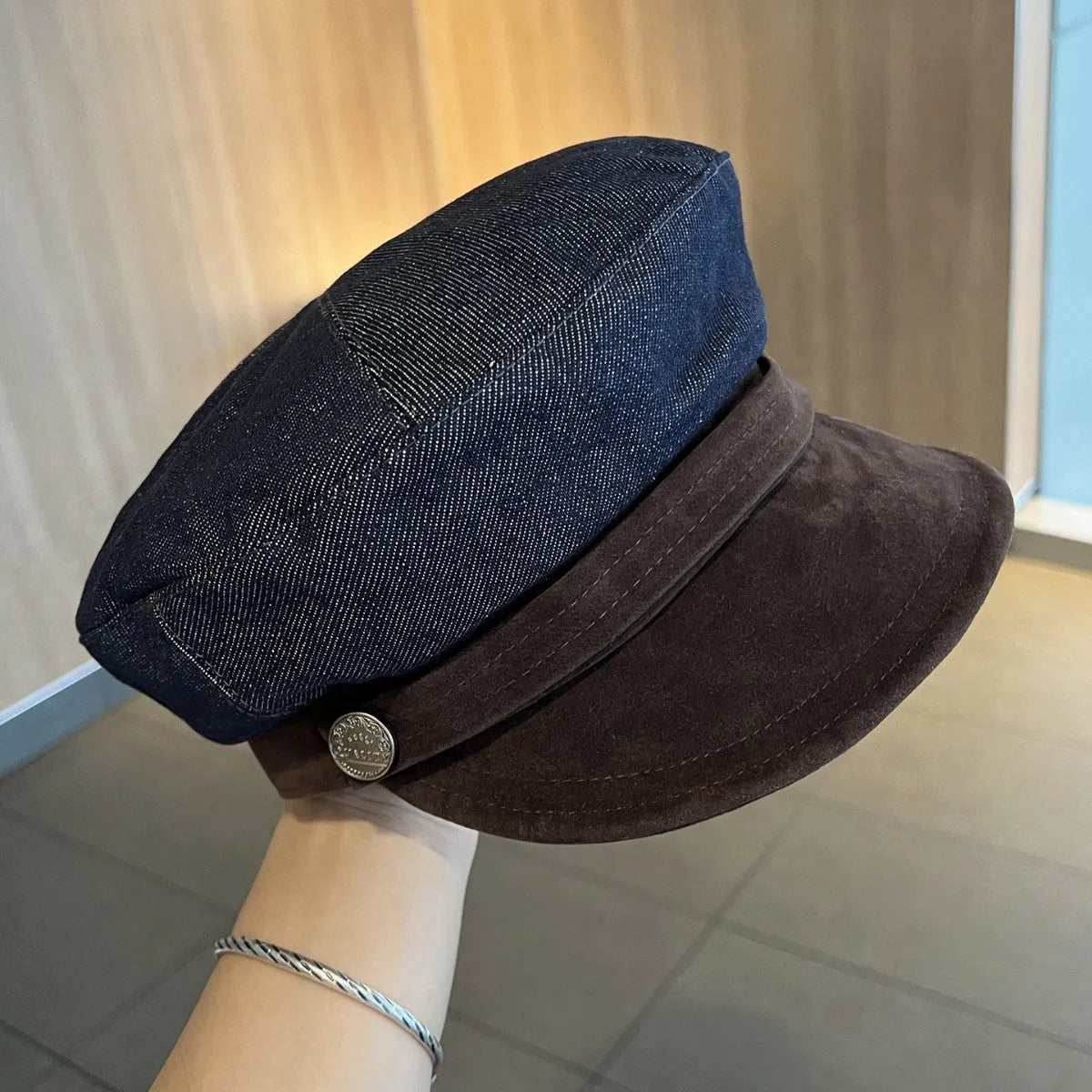 Dark blue denim octagonal newsboy hat with an adjustable fit for 54-58cm head sizes.