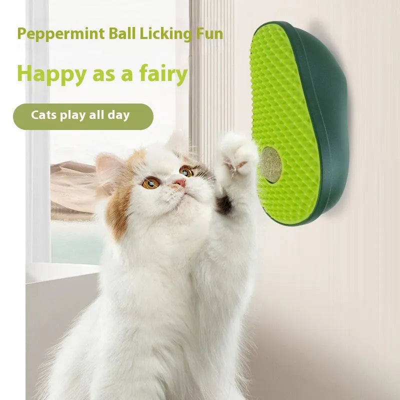 Green avocado-shaped cat scratching post toy on a plain background.
