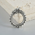 Large geometric dragon-shaped earrings in antique silver stainless steel alloy.