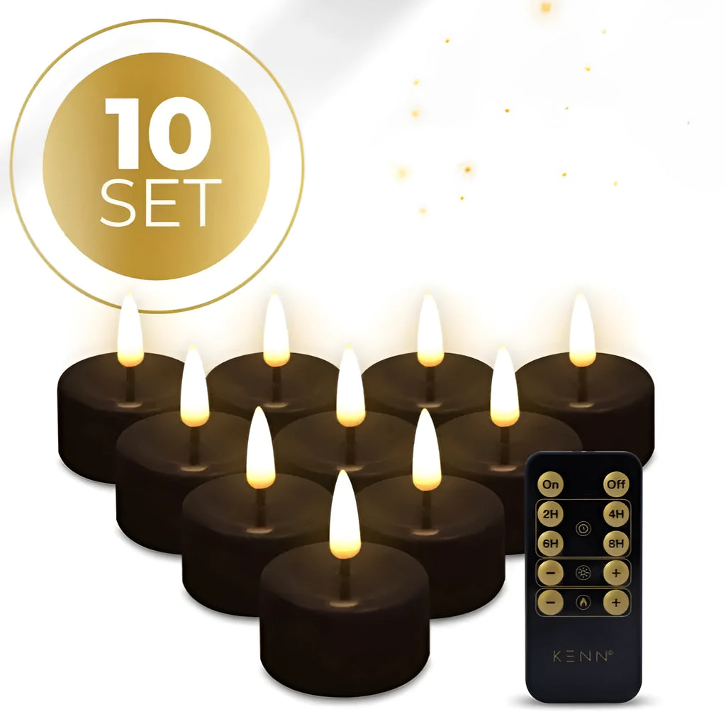 Set of four small black LED tealight candles showing their size and flameless design.