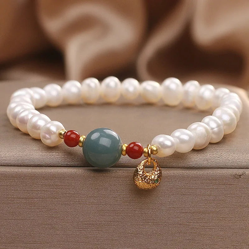 White freshwater pearl and aquamarine bracelet with opal centrepiece, ethnic style