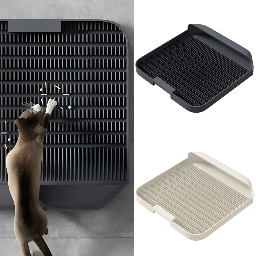 Large black cat litter pedal with slanted mouth and textured grooves beside a litter tray