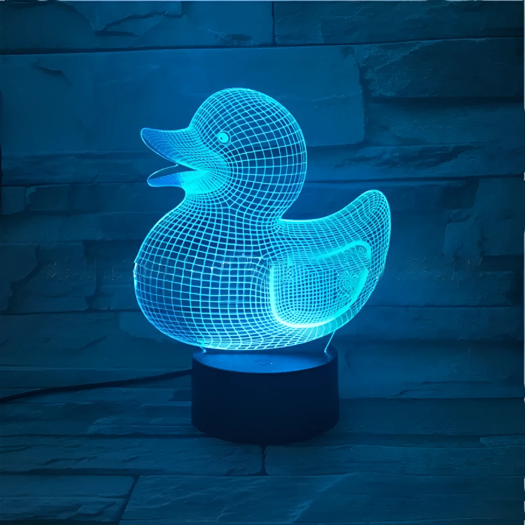 Yellow 3D duck night light with remote control on bedside table showing multiple colour options