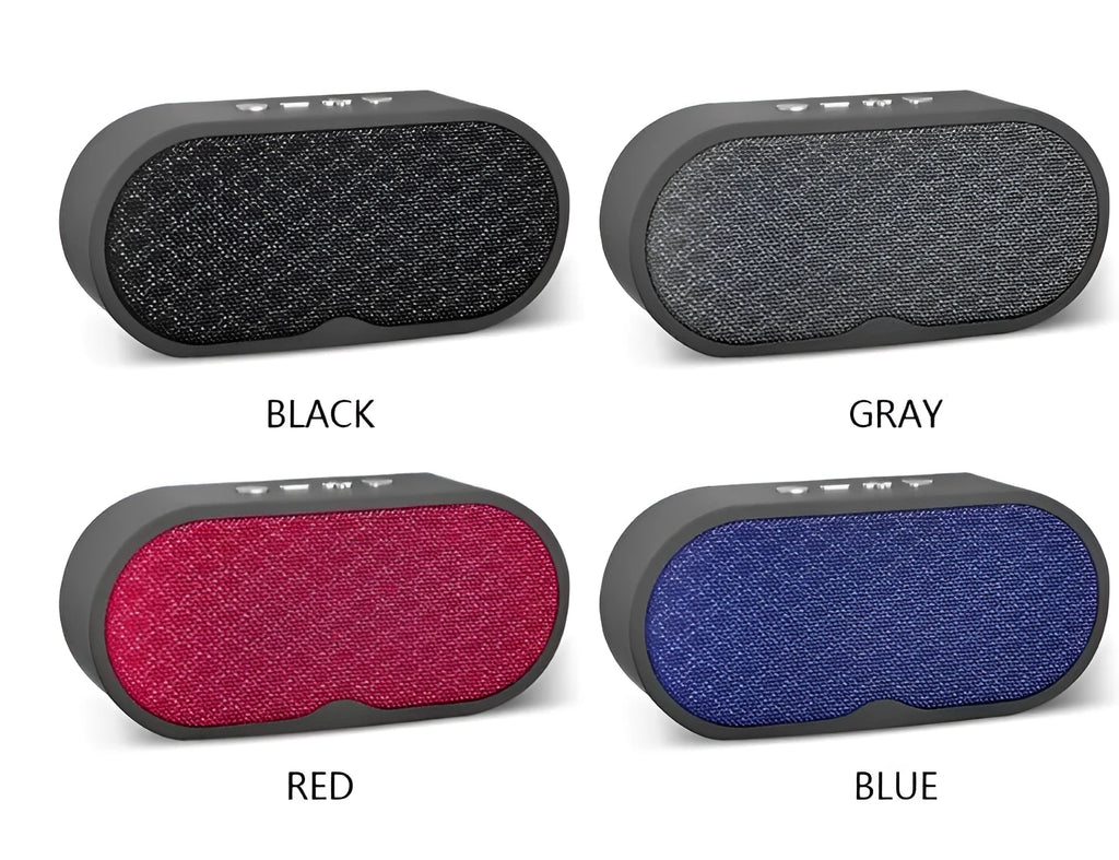 Grey portable Bluetooth speaker with subwoofer, HD microphone, TF card slot and USB port on a table.