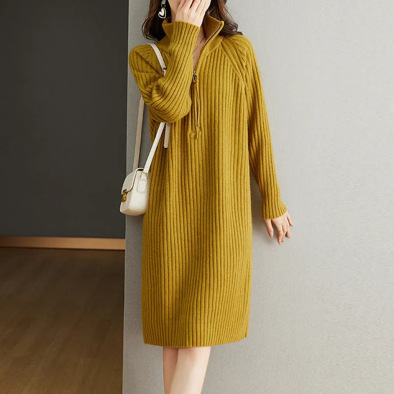 Beige casual women's skirt with half front zipper, stand collar, and long sleeves on a hanger.