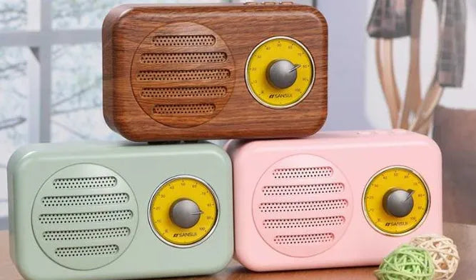 Portable Bluetooth speaker in wood grain finish with FM radio and micro USB cable