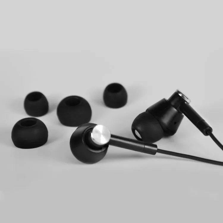 Black and white in-ear earphones with subwoofer for computer and mobile phone audio