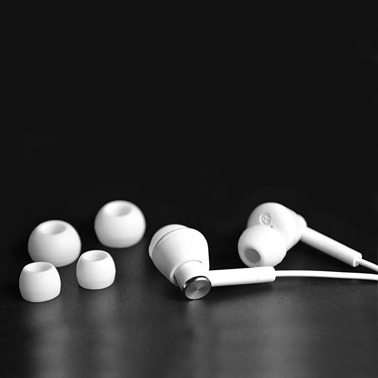 Black and white in-ear earphones with subwoofer for computer and mobile phone audio