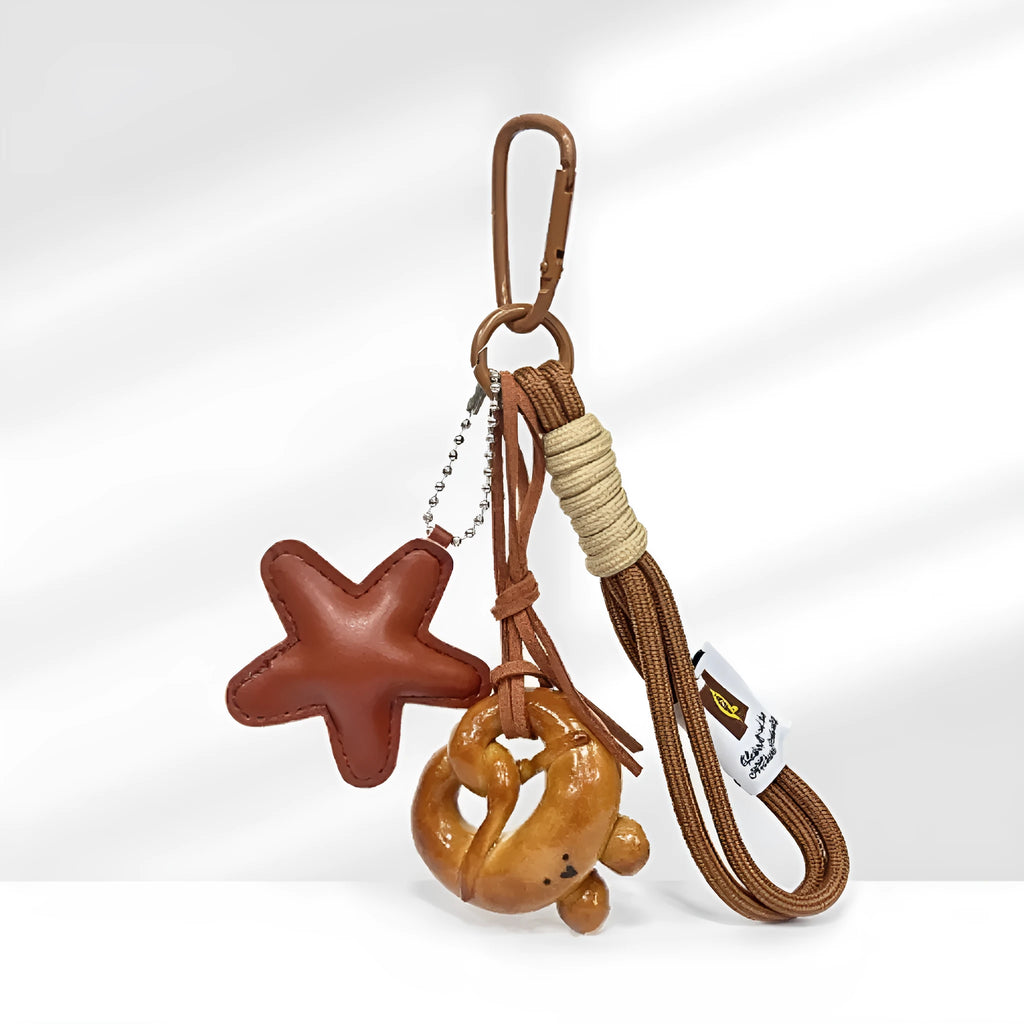 Handmade soda bread handbag pendant with food-themed designs and brown carrying strap