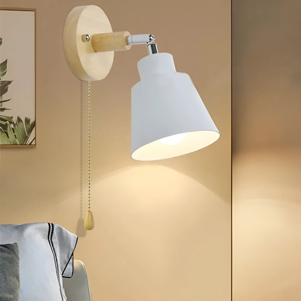 Modern minimalist log bedside lamp in black with warm light globe on wooden bedside table