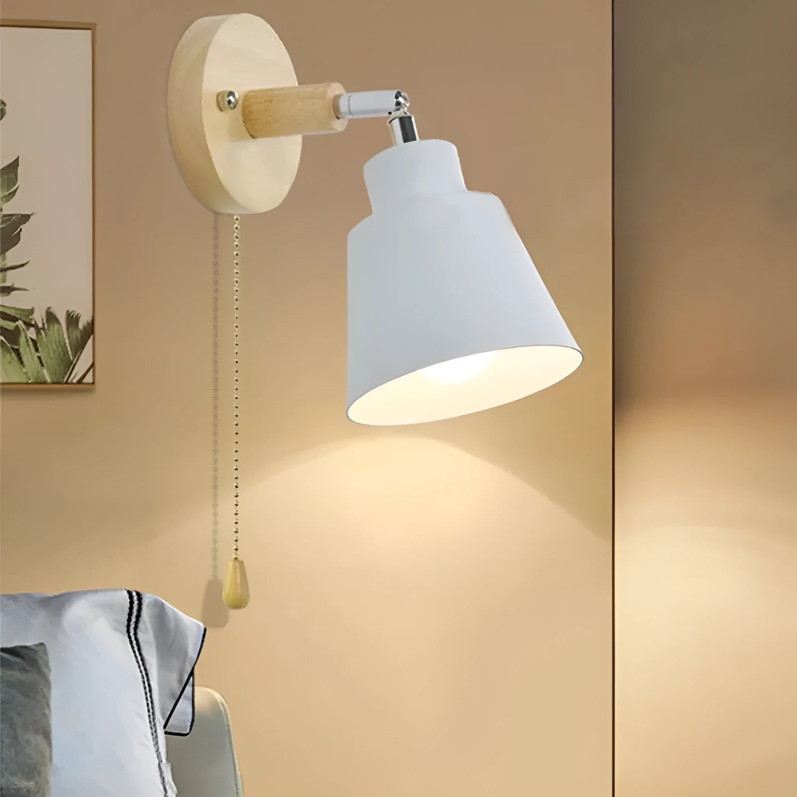 Modern minimalist log bedside lamp in black with warm light globe on wooden bedside table
