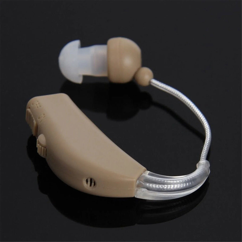 Rechargeable behind the ear hearing aid amplifier with Mini ear receiver and wireless charging case.