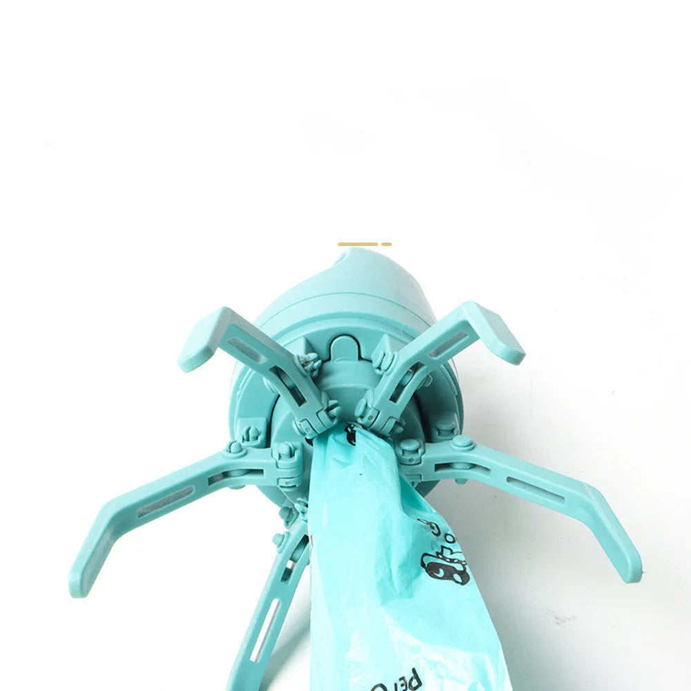Blue portable dog pooper scooper with claw mechanism and built-in bag dispenser