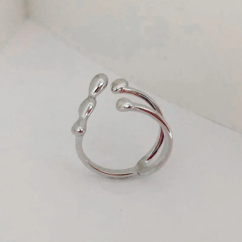 Brass opening ring with spherical elements in gold or silver finish, adjustable women's fashion jewellery