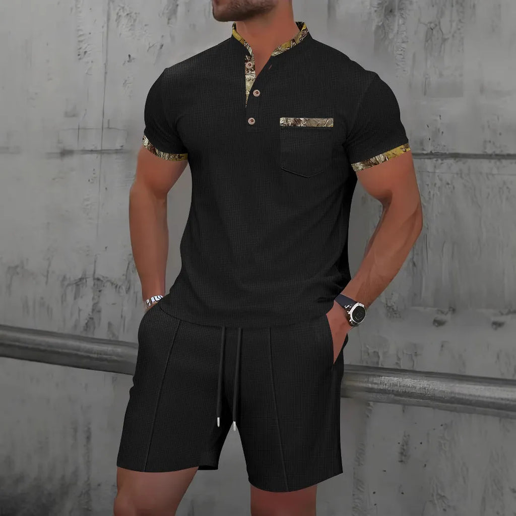 Men's grey zip-front polo collar tracksuit top and shorts set laid flat.