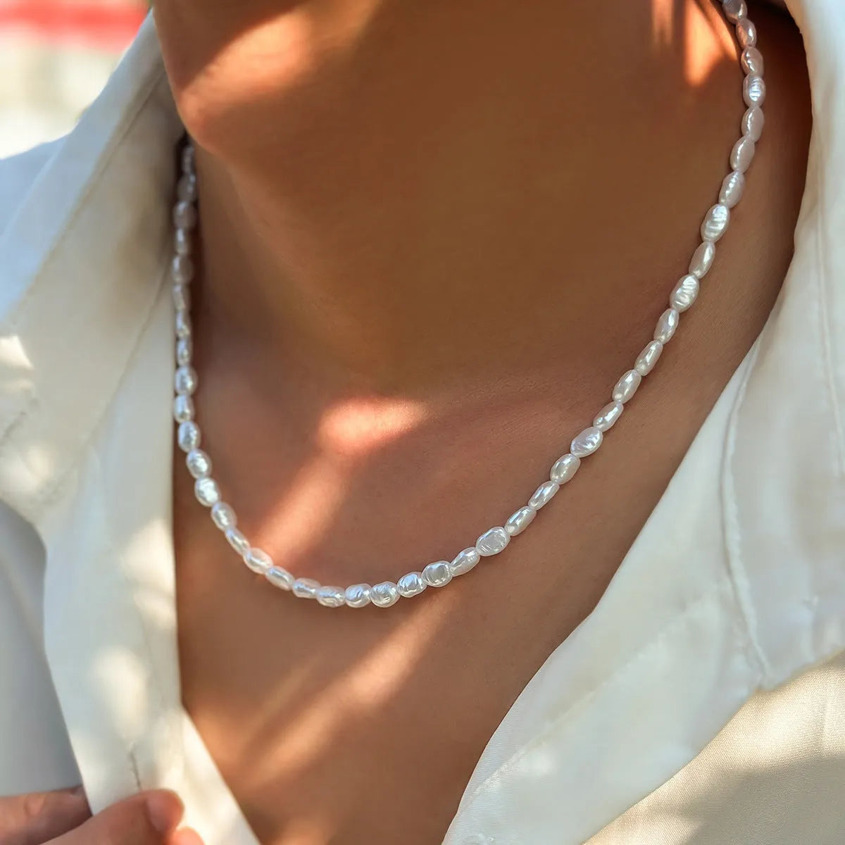 Men's white U-shaped Mother Pearl necklace on imitation pearl chain, adjustable 41-50cm length.