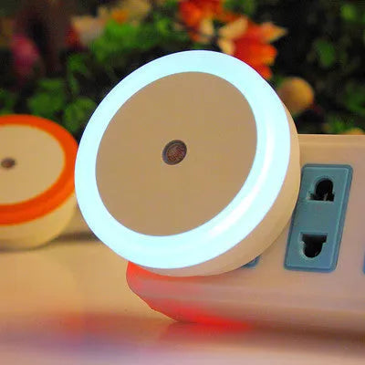 Round LED induction nightlight with halo design, shown in blue, red, white, and yellow colour options