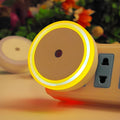 Round LED induction nightlight with halo design, shown in blue, red, white, and yellow colour options