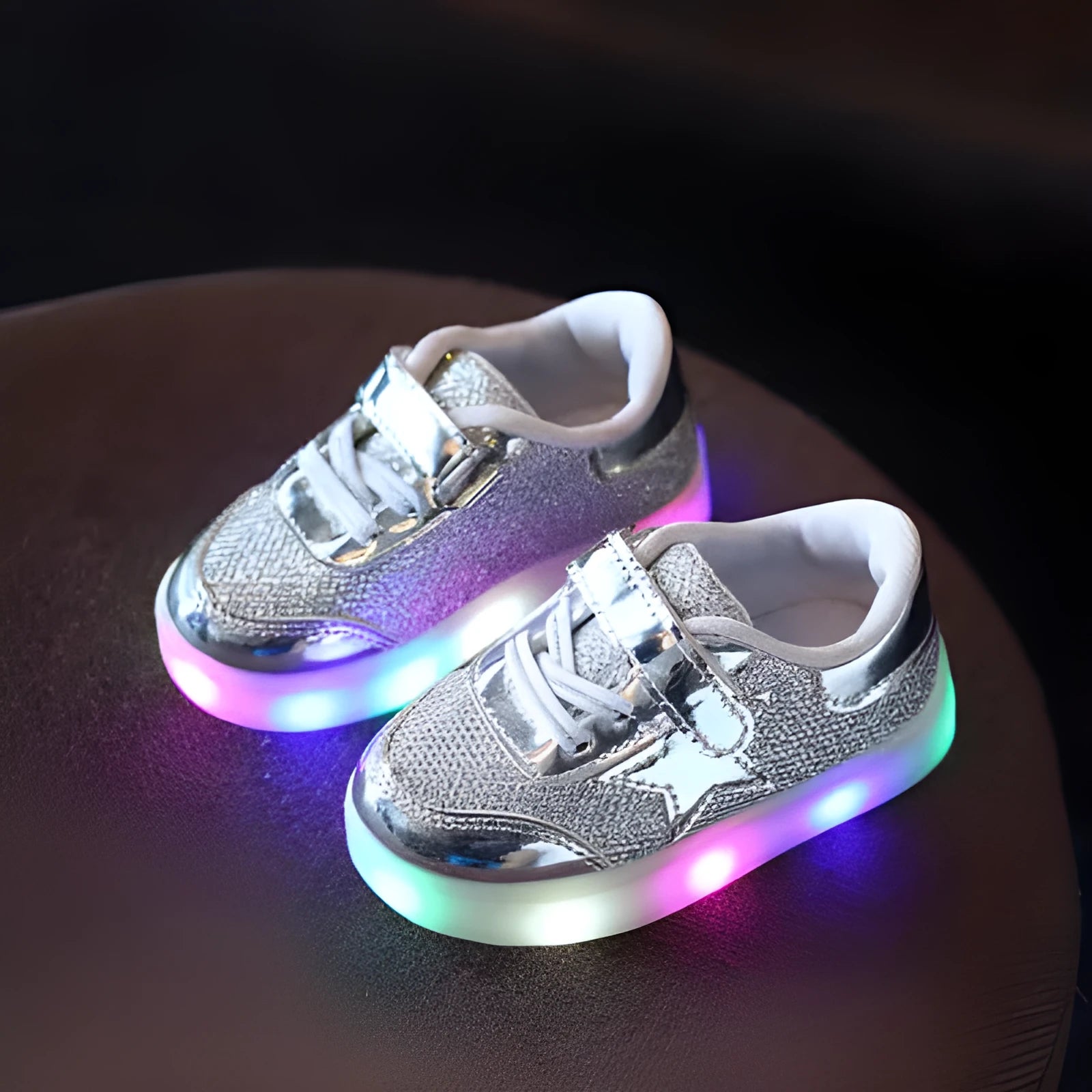 Children's LED trainers with magic button and illuminated soles in golden, pink or silvery colours