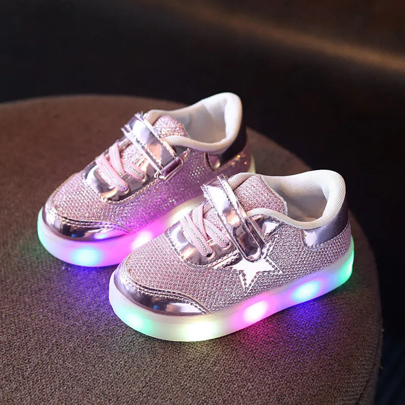 Children's LED trainers with magic button and illuminated soles in golden, pink or silvery colours