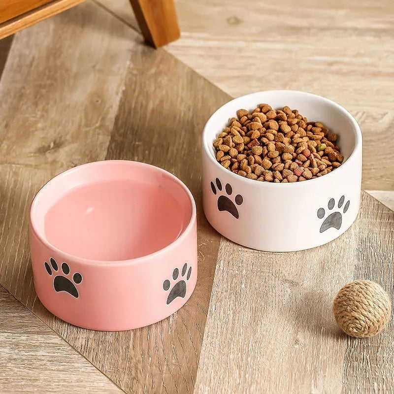 Ceramic cat bowl with high foot design and oblique mouth in cat's paw pattern