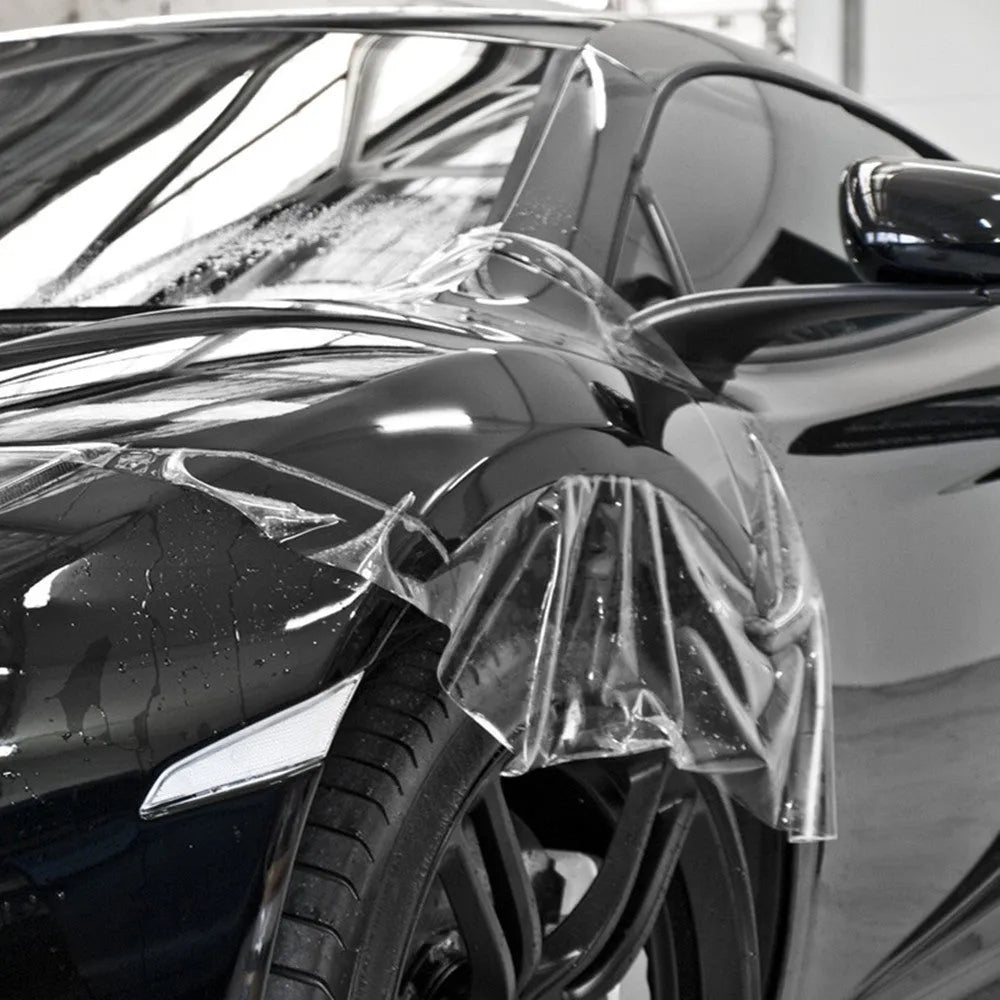 Transparent TPH car paint protection film roll showing clear coating for full vehicle exterior wrap