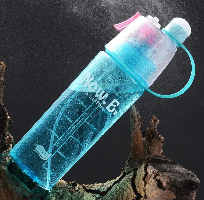 Green portable outdoor mist spray cup with handle and scale markings
