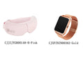 White and pink smart watch and suede cloth eye massager set on a table, showing USB charging cable.