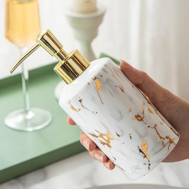 White ceramic bathroom wash kit set with two cups, a soap dish, and a bottle in a presentation box.