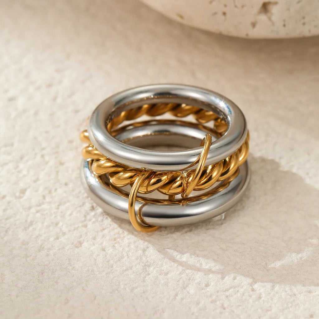 Women's gold-plated stainless steel stacked ring set in three colour options with exaggerated design