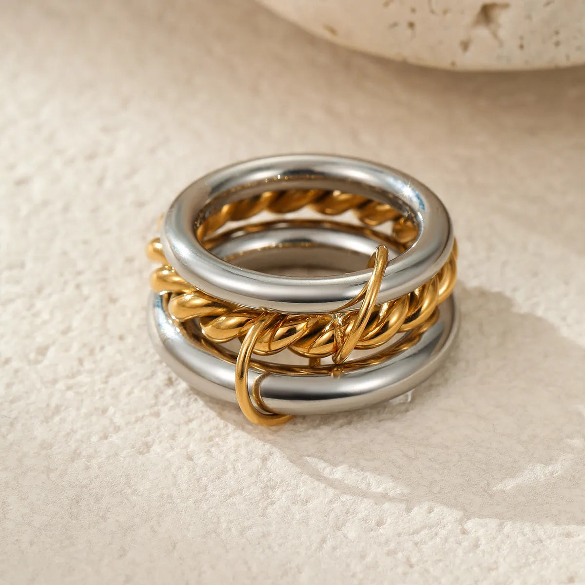 Women's gold-plated stainless steel stacked ring set in three colour options with exaggerated design