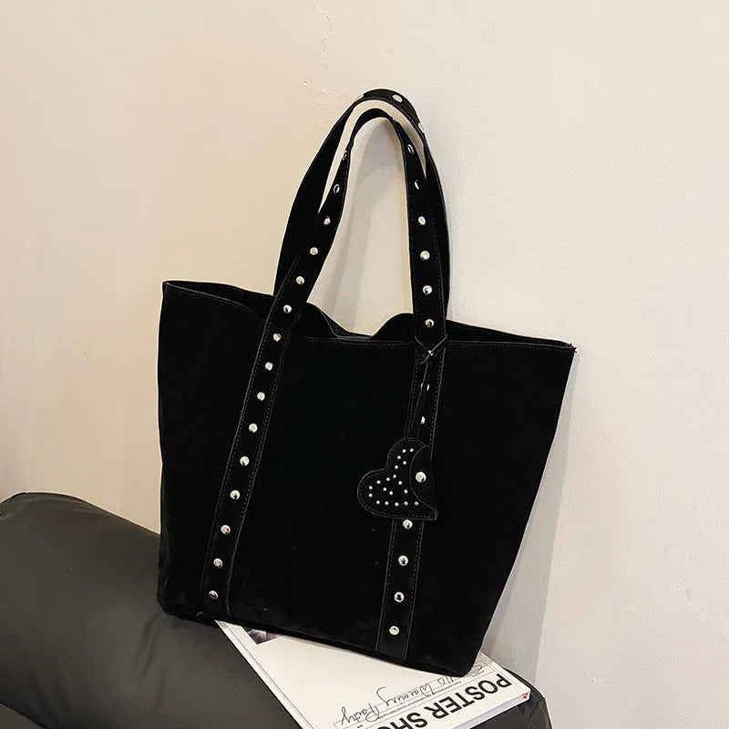 Women's black PU leather tote bag with double shoulder straps showing sandwich pocket detail