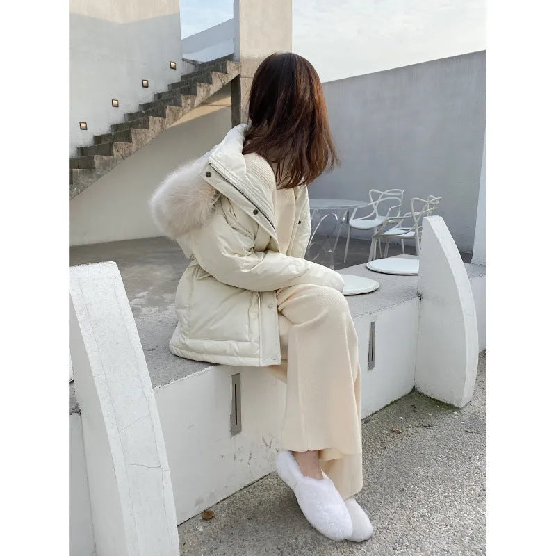 Women's cream white high-waist wide-leg knitted trousers for winter with a drooping mopping hem.