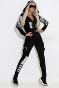 Black women's hooded jacket and trousers casual set with white wings graphic print.