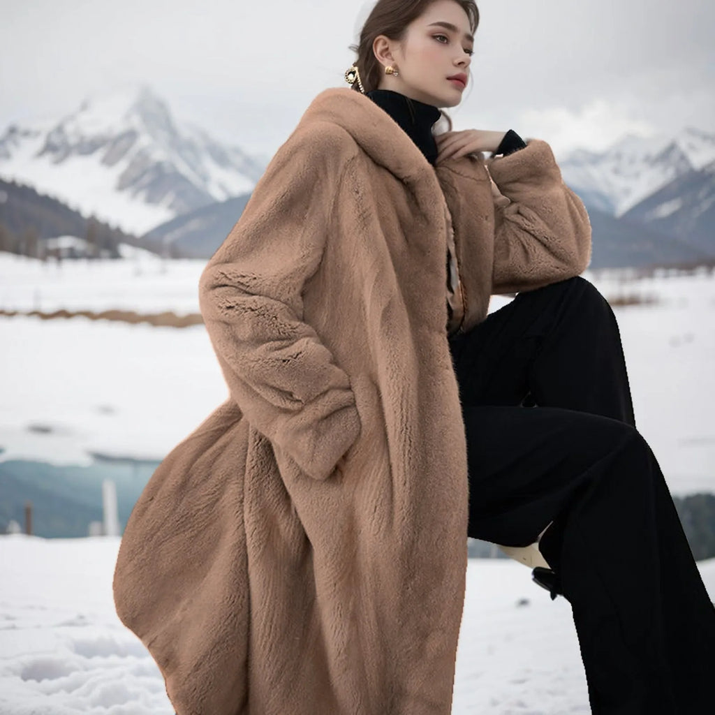Long brown leopard print faux fur coat on a hanger, showing its loose plus-size fit and full length.