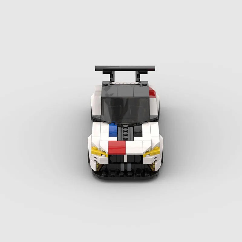 BMW M8 GTE building block car model kit assembled on a flat surface, showing 17cm length and plastic construction