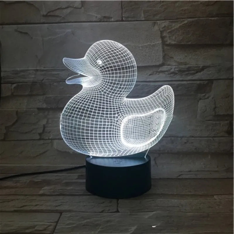 Yellow 3D duck night light with remote control on bedside table showing multiple colour options