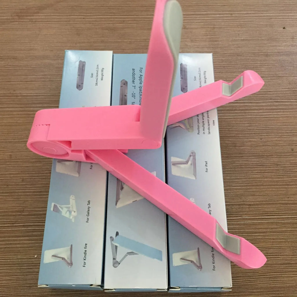Black foldable tablet holder standing upright holding a tablet, shown next to its folded flat profile.